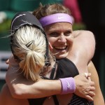
              Bethanie Mattek-Sands of the U.S. hugs Lucie Safarova of the Czech Republic, right,   after winning the women's doubles final of the French Open tennis tournament in three sets, 3-6, 6-4, 6-2, against Casey Dellacqua of Australia and Yaroslava Shvedova of Kazakhstan at the Roland Garros stadium, in Paris, France, Sunday, June 7, 2015. (AP Photo/Thibault Camus)
            