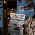 
              Phila Mombombo, a South African Kaizer Chiefs soccer club supporter, and World Cup Soccer supporter holds a newspaper headlining recent bribery allegations against local soccer officials, at his home in  Khayelitsha, South Africa, Thursday, May 28, 2015. The image of South Africa’s 2010 World Cup has been shattered by allegations that its bid over a decade ago was involved in bribes of more than $10 million to secure FIFA votes _ possibly with the knowledge or involvement of the South African government. (AP Photo/Schalk van Zuydam)
            