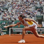 
              Italy's Flavia Pennetta returns in the fourth round match of the French Open tennis tournament against Spain's Garbine Muguruza at the Roland Garros stadium, in Paris, France, Monday, June 1, 2015. (AP Photo/Michel Euler)
            