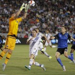 
              San Jose Earthquakes goalkeeper David Bingham, left, makes a save as teammate Clarence Goodson, right, and Los Angeles Galaxy's Robbie Keane, of Ireland, watch during the first half of an MLS soccer match, Friday, July 17, 2015, in Carson, Calif. (AP Photo/Jae C. Hong)
            