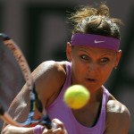 
              Lucie Safarova of the Czech Republic returns in the semifinal match of the French Open tennis tournament against Serbia's Ana Ivanovic at the Roland Garros stadium, in Paris, France, Thursday, June 4, 2015. (AP Photo/Francois Mori)
            