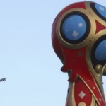 
              A plane flies past an emblem of the 2018 World Cup near the Konstantin Palace in St.Petersburg, Russia, Friday, July 24, 2015, on the eve of the Preliminary draw for the 2018 World Cup in Russia. (AP Photo/Dmitry Lovetsky)
            