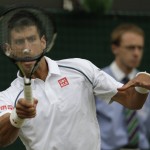 
              Novak Djokovic of Serbia returns a ball to Kevin Anderson of South Africa during their singles match against at the All England Lawn Tennis Championships in Wimbledon, London, Tuesday July 7, 2015. (AP Photo/Alastair Grant)
            