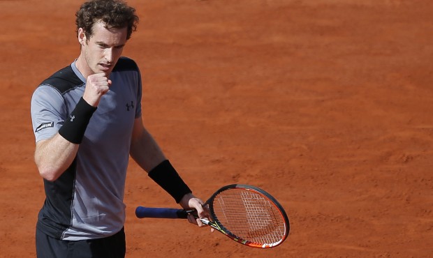 Britain’s Andy Murray clenches his fist as he plays Spain’s David Ferrer during their q...