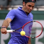 
              Switzerland's Roger Federer returns the ball to Colombia's Alejandro Falla during their first round match of the French Open tennis tournament at the Roland Garros stadium, Sunday, May 24, 2015 in Paris,  (AP Photo/David Vincent)
            