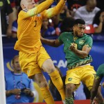 
              United States goalkeeper Brad Guzan (1) reaches for the ball next to Jamaica’s Joel McAnuff (10) for the ball in the front of the net during the first half of a CONCACAF Gold Cup soccer semifinal, Wednesday, July 22, 2015, in Atlanta. (AP Photo/John Bazemore)
            