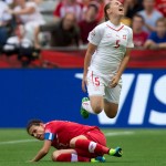 
              Switzerland's Noelle Maritz (5) is tackled by Canada's Christine Sinclair during the first half of the FIFA Women's World Cup soccer action in Vancouver, British Columbia, Canada on Sunday June 21, 2015. (Darryl Dyck/The Canadian Press via AP)
            