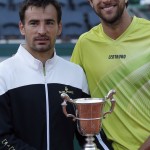 
              Croatia's Ivan Dodig, left, and Brazil's Marcelo Melo pose with their trophy after defeating Bob and Mike Bryan of the U.S. in their men's doubles final match of the French Open tennis tournament at the Roland Garros stadium, Saturday, June 6, 2015 in Paris. Dodig and Melo won 6-7, 7-6, 7-5.  (AP Photo/Michel Euler)
            