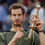
              Andy Murray of Britain holds up the winners trophy after defeating Rafael Nadal of Spain in their men's singles final match at the Madrid Open Tennis tournament in Madrid, Spain, Sunday, May 10, 2015.  Murray defeated Nadal 6-3, 6-2. (AP Photo/Paul White) )
            