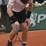 
              Britain's Andy Murray leans on his racket after missing a shot in his semifinal match of the French Open tennis tournament against Serbia's Novak Djokovic at the Roland Garros stadium, in Paris, France, Friday, June 5, 2015. (AP Photo/David Vincent)
            