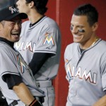 
              Miami Marlins' Ichiro Suzuki, left, of Japan, laughs along with teammate Derek Dietrich prior to a baseball game against the Arizona Diamondbacks, Monday, July 20, 2015, in Phoenix. (AP Photo/Ross D. Franklin)
            
