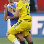 
              United States' Carli Lloyd (10) and Sweden's Elin Rubensson (23) collide during first-half FIFA Women's World Cup soccer game action in Winnipeg, Manitoba, Canada, Friday, June 12, 2015. (John Woods/The Canadian Press via AP) MANDATORY CREDIT
            