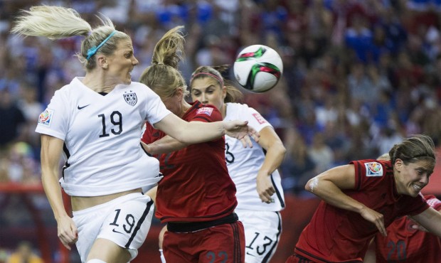 United States’ Julie Johnston (19) heads the ball toward the goal as Germany players defend d...