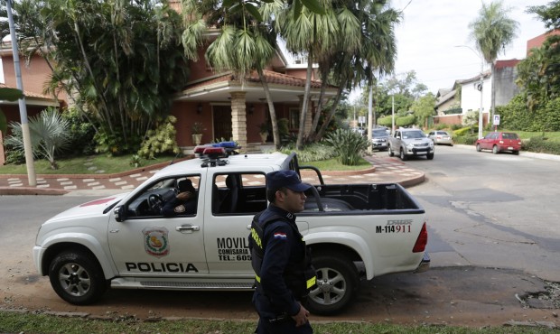Police patrol outside the home of Nicolas Leoz who’s under house arrest in Asuncion, Paraguay...