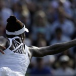 
              Venus Williams of the United States returns a ball to Aleksandra Krunic of Serbia during their singles match at the All England Lawn Tennis Championships in Wimbledon, London, Friday July 3, 2015. (AP Photo/Tim Ireland)
            