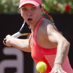 
              Simona Halep, of Romania, returns the ball to Alison Riske, of the United States, during their match at the Italian Open tennis tournament, in Rome, Wednesday, May 13, 2015. (AP Photo/Andrew Medichini)
            