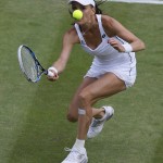 
              Agnieszka Radwanska of Poland returns a ball to Madison Keys of the United States during their singles match at the All England Lawn Tennis Championships in Wimbledon, London, Tuesday July 7, 2015. (AP Photo/Kirsty Wigglesworth)
            
