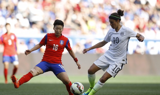 United States midfielder Carli Lloyd, right, controls the ball against South Korea midfielder Kwon ...