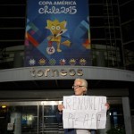 
              A man holds a handwritten sign that reads in Spanish, "Resign Argentine Soccer Association president" in front of the the sports marketing company Torneos y Competencias offices, in Buenos Aires, Argentina, Friday, May 29, 2015. In Argentina, prosecutors have charged three Argentines implicated in the  FIFA scandal with tax fraud, racketeering and money laundering for their involvement. The Federal Administration for Public Revenue charged Alejandro Burzaco, Torneos y Competencias president, and Mariano and Hugo Jinkis, owners of the sports media business Full Play. All were charged on Wednesday in the U.S. of bribing top soccer officials in exchange for the rights to international tournaments. (AP Photo/Natacha Pisarenko)
            