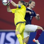 
              Germany goalkeeper Nadine Angerer, left, catches a shot as France's Gaetane Thiney moves in during the second-half of a quarterfinal match in the FIFA Women's World Cup soccer tournament, Friday, June 26, 2015, in Montreal, Canada. (Ryan Remiorz/The Canadian Press via AP) MANDATORY CREDIT
            