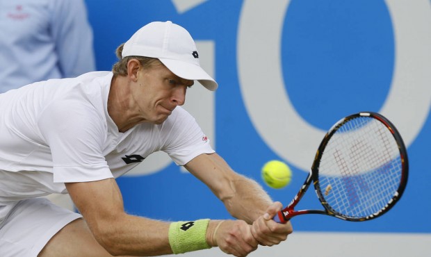 Kevin Anderson of South Africa plays a return to Gilles Simon of France during their semifinal tenn...