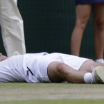 
              Richard Gasquet of France lays on the court after defeating Stan Wawrinka of Switzerland during the men's quarterfinal singles match, at the All England Lawn Tennis Championships in Wimbledon, London, Wednesday July 8, 2015. Gasket won 6-4, 4-6, 3-6, 6-4, 11-9. (AP Photo/Pavel Golovkin)
            