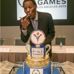 
              Olympic Gold medalist Rafer Johnson tastes a cake celebrating the 47th anniversary of the first Special Olympics World Games he attended, the first one ever held, at Chicago's Soldier Field in July 1968, during a news conference in Los Angeles, Monday, July 20, 2015. (AP Photo/Damian Dovarganes)
            