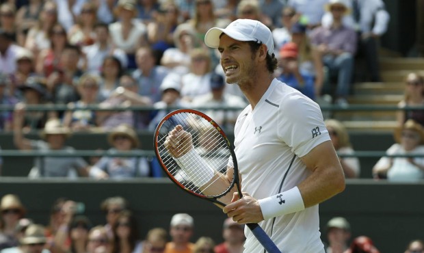 Andy Murray of Britain celebrates after winning the single match against Robin Haase of the Netherl...