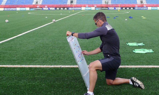 Canada coach John Herdman sets up a board before the team’s practice for the FIFA Women&#8217...