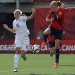 
              England's Toni Duggan, left, and Norway's Marita Skammelsrud Lund vie for the ball during the first half of a second round soccer game at the FIFA Women's World Cup, Monday, June 22, 2015, in Ottawa, Ontario, Canada. (Adrian Wyld/The Canadian Press via AP) MANDATORY CREDIT
            