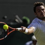 
              Stan Wawrinka of Switzerland returns a ball to  David Goffin of Belgium during their singles match against at the All England Lawn Tennis Championships in Wimbledon, London, Monday July 6, 2015. (AP Photo/Tim Ireland)
            