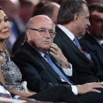 
              FIFA President Sepp Blatter, center, and his partner Linda Barras, left, attend the preliminary draw for the 2018 soccer World Cup in Konstantin Palace in St. Petersburg, Russia, Saturday, July 25, 2015. (AP Photo/Ivan Sekretarev
            