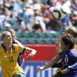 
              Japan's Shinobu Ohno (11) is challenged by Australia's Elise Kellond-Knight, rear right, as Alanna Kennedy (14) looks on during first half FIFA Women's World Cup quarter-final soccer action in Edmonton, Alberta, Canada, Saturday, June 27, 2015.   (Jeff McIntosh/The Canadian Press via AP) MANDATORY CREDIT
            