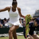 
              Madison Keys of the United States takes a  towel from ball girl during her singles match against Olga Govortsova of Belarus, at the All England Lawn Tennis Championships in Wimbledon, London, Monday July 6, 2015. (AP Photo/Pavel Golovkin)
            