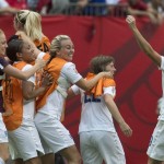 
              England players celebrate a 2-1 win over Canada during a quarterfinal of the Women's World Cup soccer tournament, Saturday, June 27, 2015, in Vancouver, British Columbia, Canada. (Jonathan Hayward/The Canadian Press via AP)
            
