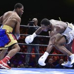 
              Shawn Porter, left, knocks Adrien Broner off-balance during a welterweight fight on Saturday, June 20, 2015, in Las Vegas. Porter won by unanimous decision after a 12-round bout. (AP Photo/David Becker)
            