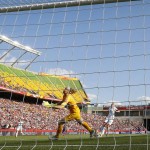 
              In this July 1, 2015, photo, England goalkeeper Karen Bardsley, left, tries to prevent the ball from entering the net on a kick from teammate Laura Bassett, on ground center, as Steph Houghton (5), second from right, and Japan's Yuki Ogimi (17) look on during first half FIFA Women's World Cup semi-final soccer action in Edmonton, Alberta, Canada. Bassett sobbed after the final whistle in Edmonton, Canada _ and the hurt was shared across England. (Jeff McIntosh/The Canadian Press via AP)
            