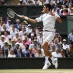 
              Novak Djokovic of Serbia plays a return to Roger Federer of Switzerland during the men's singles final at the All England Lawn Tennis Championships in Wimbledon, London, Sunday July 12, 2015. (AP Photo/Alastair Grant)
            