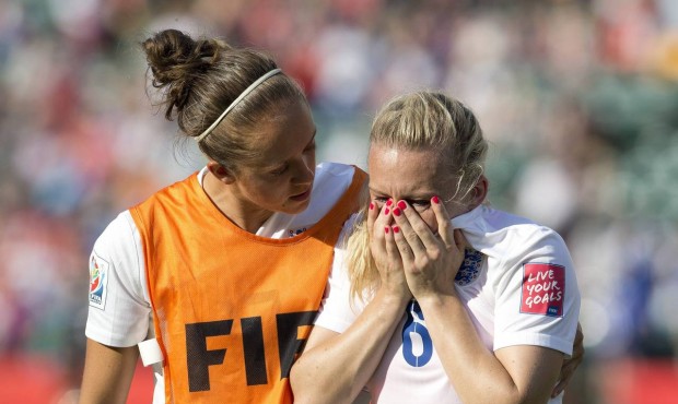 England’s Josanne Potter, left, consoles Laura Bassett (6) after the team’s 2-1 loss to...