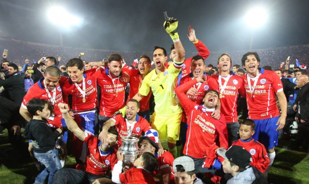 Chile’s players celebrate with the Copa America trophy after defeating Argentina in the final...