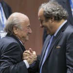 
              FILE - In this Friday, May 29, 2015 file photo, FIFA president Sepp Blatter after his election as President greeted by UEFA President Michel Platini, right, at the Hallenstadion in Zurich, Switzerland. Blatter has been re-elected as FIFA president for a fifth term, chosen to lead world soccer despite separate U.S. and Swiss criminal investigations into corruption. The 209 FIFA member federations gave the 79-year-old Blatter another four-year term on Friday after Prince Ali bin al-Hussein of Jordan conceded defeat after losing 133-73 in the first round.  (Patrick B. Kraemer/Keystone via AP, File)
            