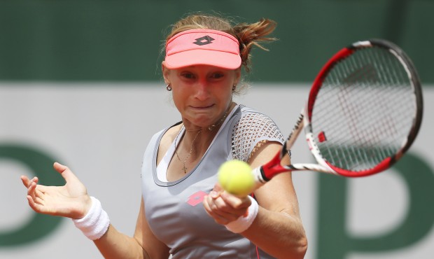 Russia’s Ekaterina Makarova returns the ball to compatriot Elena Vesnina during their third r...