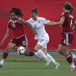 
              England's Lucy Bronze battles Mexico's Bianca Sierra, left, and Alina Garciamendez during the first half of a FIFA Women's World Cup soccer game in Moncton, New Brunswick, Canada, on Saturday, June 13, 2015. (Andrew Vaughan/The Canadian Press via AP) MANDATORY CREDIT
            