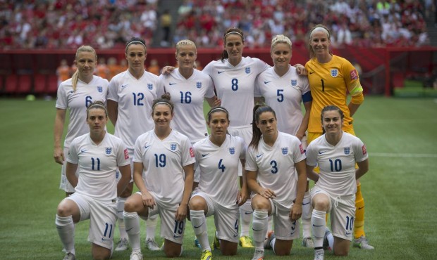 The England squad poses for a photo prior to a quarterfinal against Canada in the Women’s Wor...