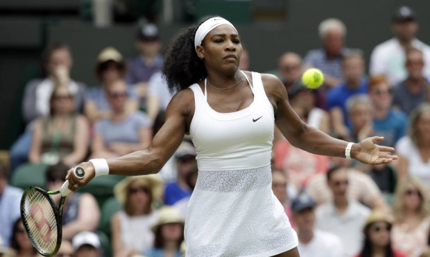 Serena Williams of the United States makes a return to Venus Williams of the United States, during ...
