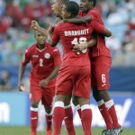 
              Cuba players celebrate after a CONCACAF Gold Cup soccer match against Guatemala in Charlotte, N.C., Wednesday, July 15, 2015. Cuba won 1-0. (AP Photo/Gerry Broome)
            