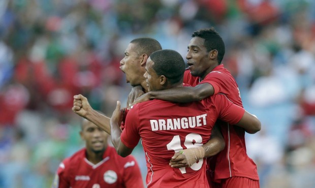 Cuba players celebrate after a CONCACAF Gold Cup soccer match against Guatemala in Charlotte, N.C.,...