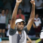 
              Rajeev Ram celebrates after defeating Ivo Karlovic, of Croatia, in the Tennis Hall of Fame Championship final in Newport, R.I., Sunday, July 19, 2015. (AP Photo/Michael Dwyer)
            