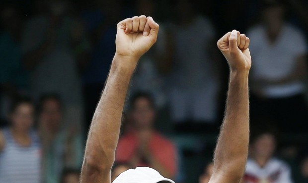 Rajeev Ram celebrates after defeating Ivo Karlovic, of Croatia, in the Tennis Hall of Fame Champion...