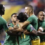 
              Jamaica’s Darren Mattocks, center, is embraced by teammate Michael Hector, right, after Mattocks scored a goal during the first half of a CONCACAF Gold Cup soccer semifinal against the United States on Wednesday, July 22, 2015, in Atlanta. (AP Photo/David Goldman)
            